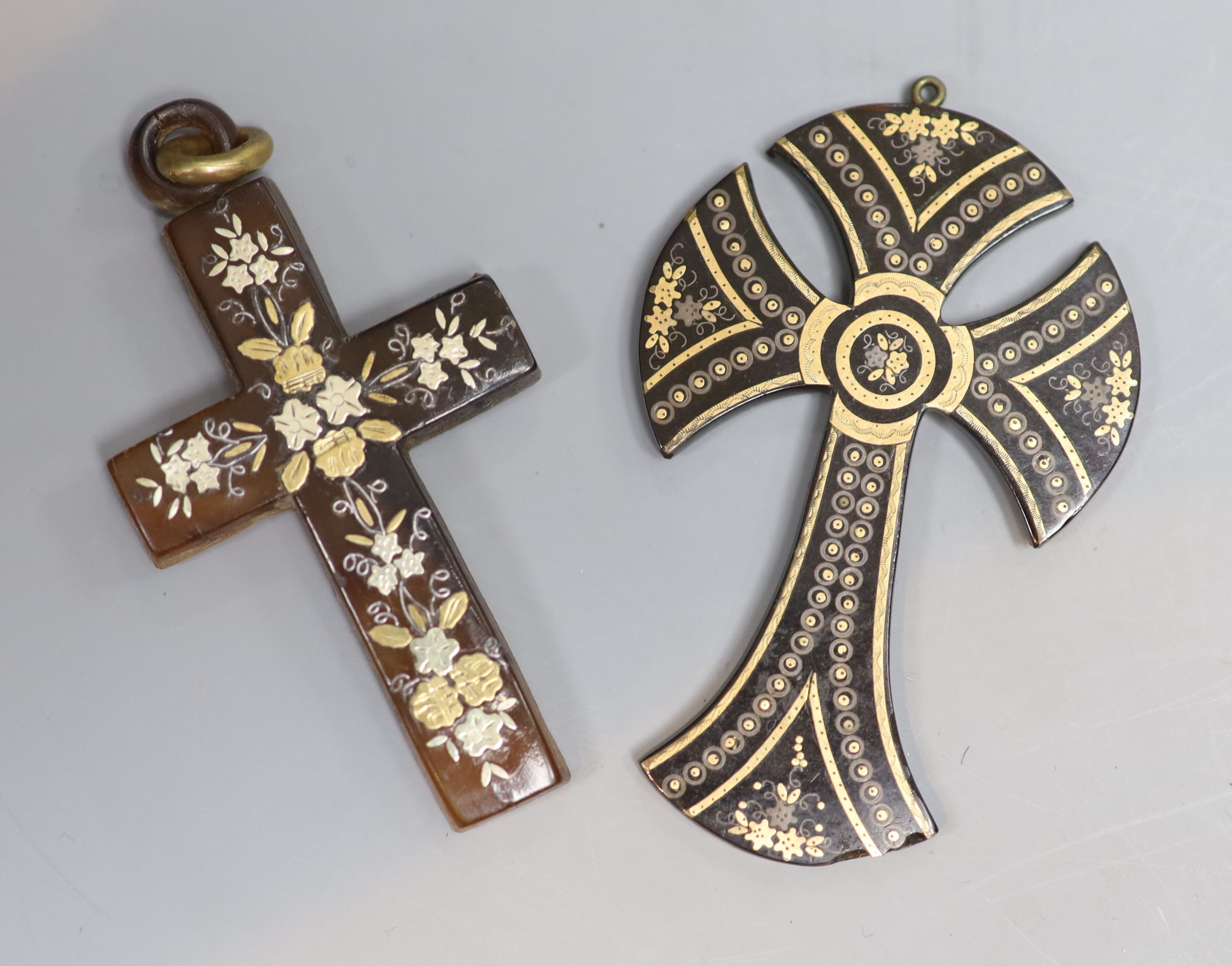 Two late 19th/early 20th century tortoiseshell and pique cross pendants